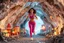 Placeholder: make a video pretty crystal cave covered with jewells and CIFI jewell lights and miniature city buildings and miniature people and streets, a beautiful fashion model lady with cute,curvy hair,makeup, in pretty sports suit is running inside cave ,dynamic camera fallow her inside cave capturing full body, dynamic lights.