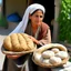 Placeholder: A rural mother sells homemade bread