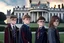 Placeholder: realistic young Harry Potter movie characters in front of white house