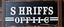 Placeholder: fill composition with large and wide historical hand painted old western sign that reads: "SHRIFFS OFFICE" white on black with inset white stripe boarder aged paint on wood sanserif