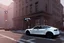 Placeholder: A Tesla 'Model Y' is going at a high speed, near the building of the 'Friends' series in New York. (CINEMATIC, WIDE ANGLE LENS, PHOTO REAL)
