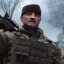 Placeholder: Octane render, dramatic lighting, 8k 64 megapixels hdr, president of Ukraine wearing special forces gear and camouflage pattern plate carrier standing on the main square of Moscow, zombiecore style, anamorphic lensflaresintricate details, realistic, octane, unreal engine, portrait, natural lighting,zoomed out + portrait, volumetric lighting, shiny,extreme detail, Photorealism, High detail, Hyper realistic, macro lens blur,abstract paint, sharp,eos5d mark 4, ef 85mm 5.6, focus,