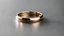 Placeholder: luxury high resolution jewelry, minimalist wedding band, angled top down, studio bright, Nikon D850 105mm, close-up centred shot — ar 2:1