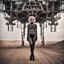 Placeholder: beautiful caucasian half cyborg woman, black metal body and limbs, chrome details, anorexic figure, short blond wavy bob haircut, dystopian, desert scene