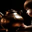 Placeholder: The reflection of a child on the surface of an old copper teapot