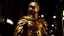 Placeholder: Imagine the image of the falcon-headed god Mentu, who has transformed into a living being walking at night through the streets of Cairo, staring at buildings and cars and marveling at this technology that man has achieved. The image is ominous, arousing fear and terror to everyone who looks at the falcon-headed god Mentu while he is wearing golden clothes decorated with bright and imaginative neon colors. The image has been done. Capture it from below, ten meters away from the god Mentu, who app