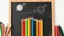 Placeholder: A blackboard sketch with a bunch of colored pencils in the middle of the image