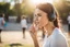 Placeholder: cute brunette woman listening a training in sunshine