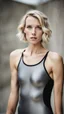 Placeholder: beautiful anorexic woman, total shot, short grey metallic triathlon swimsuit, short blond wavy bob hair, blurred concrete background