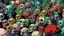 Placeholder: hundreds of non-anatomically correct, dark comic art, graphic novel,human skulls stacked into a wall unusual neon lighting, high velocity, 64k, dystopian, vray, a picture of a dark, comedic, anatomically correct wall of colorful tightly packed skulls of varying sizes and expressions, photo realistic, insanely meticulous, highly detailed, part of a collection of bones on display, 64k, dystopian, vray , ALL DRAWN IN THIN LINES OF NEON LIGHT AND COLORS