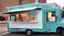 Placeholder: modern looking food truck that has a bunch of bright paint and flashy lights