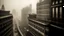 Placeholder: A dramatic, high-angle, black and white cinematic shot of a vintage elevated train, blurred with motion, curving around an ornate, historical skyscraper in a foggy, sepia-toned cityscape. The architecture is detailed and imposing, with many windows and decorative elements. In the distance, other skyscrapers rise through the mist, and a blimp is visible in the sky, evoking a sense of early 20th-century urban grandeur and a touch of retro-futurism. The lighting is moody and atmospheric, with a str