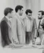 Placeholder: Pencil sketch of Four doctors are discussing ، on lined paper