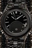 Placeholder: Black wristwatch set with precious stones