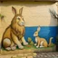 Placeholder: A rabbit and a lion on the wall