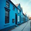 Placeholder: Fotografia di strada falsa a Magog blu weirdcore dai colori vivaci. Non luogo falso, inusuale. Max Ernst. Le case sono false e dipinte di nero chiaro con cose stilizzate e dettagli. Ci sono finestrelle false quadrate, che danno un senso distopico e molto surreale, disposte in modo casuale. L'atmosfera generale sembra noiosa e onirica, con un contrasto tra elementi reali ed elementi dipinti falsi