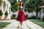 Placeholder: very beautiful lady with beautiful midi dark gray-red lace skirt and lace top with curvy hair sports shoes standing in a nice villa yard with trees flowers ,16 by 9