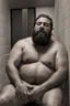 Placeholder: full figure photography of a sicilian man 38 year old man similar to bud spencer chubby muscular bearded sleeping, open mouth, shirtless, manly chest, short beard, long hair, closed eyes, big shoulders. sitting in a dark elevator, strong top light, completely sweat, photorealistic, ambient occlusion , view from the ground