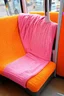 Placeholder: Métro with cosy seats, orange, pink, hippie, crochet, with blankets