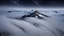 Placeholder: looking down from space at a misty mountain coming through the mist and surrounded by the mist at night starry sky