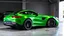 Placeholder: Mercedes-Benz AMG GT63s, green, with four side doors parked in a luxury garage, with the car facing right