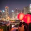 Placeholder: A professional night shot of a romantic far future city, seoul, couple holding hands, trending on Artstation, sharp soft focus, highly detailed, crowded, red balloons falling, couple facing away, girl with black hair, Incredibly detailed 8K resolution HDR photograph of a hyper detailed photorealistic storybook laying open with weathered rifled pages meticulously illustrated by Brian Froud and Josephine Wall, album cover art, imagination, upscaled, sharp focus, space