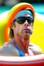 Placeholder: brad pitt sitting in donut swim ring with swimming-goggles on