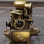 Placeholder: Old single cylinder engine, golden, small size, single