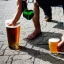 Placeholder: man pouring a beer on the ground