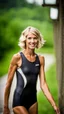 Placeholder: anorexic beautiful woman, age 21, total shot, short anthracite triathlon swimsuit, blonde wavy bob haircut, blurred background