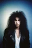 Placeholder: professional quality 35mm photograph, Chiaroscuro lighting, deep shadows, rich deep colors, facial portraits, 1980, 15-year-old Gene Simmons, ((1980's big hair, long, teased up Spikey Motley Crue style hair)), black hair, facial portraits, foggy, cloudy blue wall with assorted designs and multiple floral arrangements in the background, 4k, 8k, 16k, 32k, 100k UHD, Ultra-Hyper Resolution, dark, sultry eyeshadow, eyeliner, mascara, rouge, lipstick, from the rock and roll band KISS