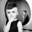 Placeholder: Russian short hair beautiful tomboy boyish boylike short man's haircut boyish features shortcut in black girlish nightgown in hotel