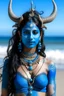 Placeholder: A photo of a blue skin Hindu goddess with painted blue skin, wavy black hair deer antlers standing on a sunny beach