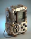 Placeholder: C4D render of a steampunk game boy with mechanical gears. Minecraft is on the screen. Designed by Dieter Rams.