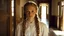 Placeholder: Closeup of a beautiful caucasian 16 year old girl. She has long blonde hair worn in two braids. She is wearing a white frilly silk blouse. She is standing in the hallway of an old house. She is gazing at the viewer.