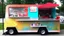 Placeholder: modern looking food truck that has a bunch of bright paint and flashy lights and fireworks