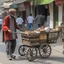 Placeholder: A street vendor pulling a cart