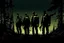 Placeholder: four persons, standing, silhouette, comic book,post-apocalypse, backpack,, forest, night time, illustration