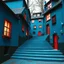 Placeholder: Fotografia di strada assurda e falsa orripilante blu weirdcore dai colori vivaci, liminalcore. Escher. Confusione geometrica. Scale che scendono. Yves Tanguy. Non luogo falso, inusuale. Le case sono false e dipinte di nero chiaro con cose stilizzate e dettagli. Ci sono finestrelle false quadrate, che danno un senso distopico e molto surreale, disposte in modo casuale. L'atmosfera generale sembra noiosa e onirica, con un contrasto tra elementi reali ed elementi dipinti falsi, René Magritte