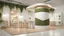 Placeholder: Corner exhibition stand in light colors with wood elements and greenery with two meeting areas