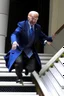 Placeholder: Joe Biden dressed as a wizard falling down steps