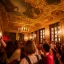 Placeholder: Party in a schloss, cheering people, Austrian aesthetic, warm colors, wood, green, red, 8k, HD, cinematography, photorealistic, Cinematic, Color Grading, Ultra-Wide Angle, Depth of Field, hyper-detailed, beautifully color-coded, insane details, intricate details, beautifully color graded, Cinematic, Color Grading, Editorial Photography, Depth of Field, DOF, Tilt Blur, White Balance, 32k, Super-Resolution, Megapixel, ProPhoto RGB, VR, Halfrear Lighting, Backlight