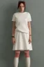 Placeholder: Billie Eilish, white stockings, skirt, t-shirt