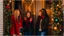 Placeholder: "I'm envisioning a heartwarming scene featuring three best friends gathered by the door during the Christmas season. The entrance of a cozy home is adorned with festive decorations, including Christmas lights framing the door and a wreath with colorful ornaments. The three friends, dressed in stylish winter clothing, share laughter and joy as they prepare to celebrate together. One of the friends holds a six-pack of beer, adding a touch of festive cheer. The expressions on their faces reflect th