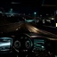 Placeholder: night time, a car dashboard lighting up, a dark road in the windscreen, with a beautiful city in the distance