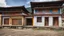 Placeholder: Houses in Kuruthang, Bhutan, traditional style, Bhutanese penis mural, beautiful composition, award-winning photograph, astonishing realism