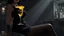 Placeholder: midle close up gray-toned, contrasting graphics, a lady in a black casual dress, black lace nice nylon stockings sitting on a bar chair in bar, holding a yellow mimosa cocktail in her long black gloved hand, atmospheric, strong contrasts, shadowy background, focus on the hand holding the cocktail, moody, pale ligts, anime style, cinematic