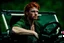 Placeholder: Photograph of a young rugged looking male with red hair and green eyes sitting in the drivers seat of a jeep close up photo realistic