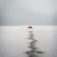 Placeholder: A captivating hyper minimalist photograph of a barren snow-covered field on a grey day. The overall color palette is muted. In the distance there is a single red beach umbrella in ground. The field stretches out in a long view creating a sense of isolation and desolation.