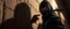 Placeholder: close up on guard pointing at professional ninja thief climbing a wall during lightening,